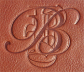 blind debossed monogram on leather pad holder